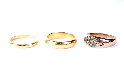 Lot 132 - Two 22ct yellow gold wedding rings; and another ring