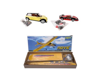 Lot 185 - A radio-controlled model of a F1 Ferrari; and two Wind Speed remote controlled cars