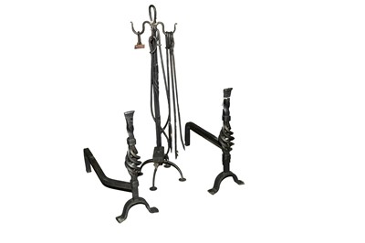 Lot 130 - A cast metal fire companion set; and a pair of andirons