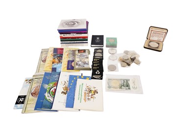 Lot 957 - A collection of uncirculated commemorative coin sets; with other commemorative crowns and coins