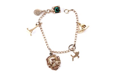 Lot 144 - A gold charm bracelet