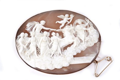 Lot 230 - A carved shell cameo brooch, decorated with Helios