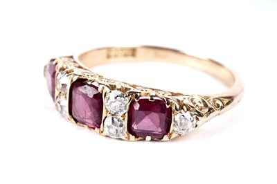 Lot 241 - A Victorian style garnet and diamond ring