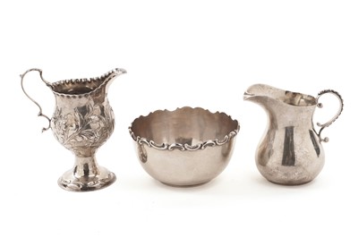 Lot 324 - Two silver cream jugs; and a silver sugar bowl