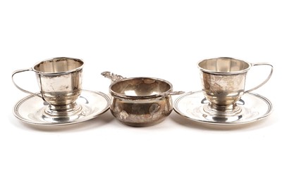 Lot 335 - An Elizabeth II silver tea sieve and stand; and two cup holders and saucers