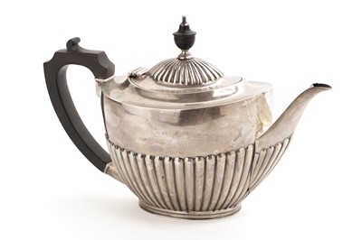 Lot 360 - A George V silver teapot by Harrods