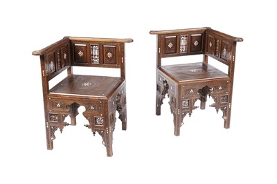 Lot 1442 - A pair of Syrian teak mother-of-pearl inlaid corner chairs