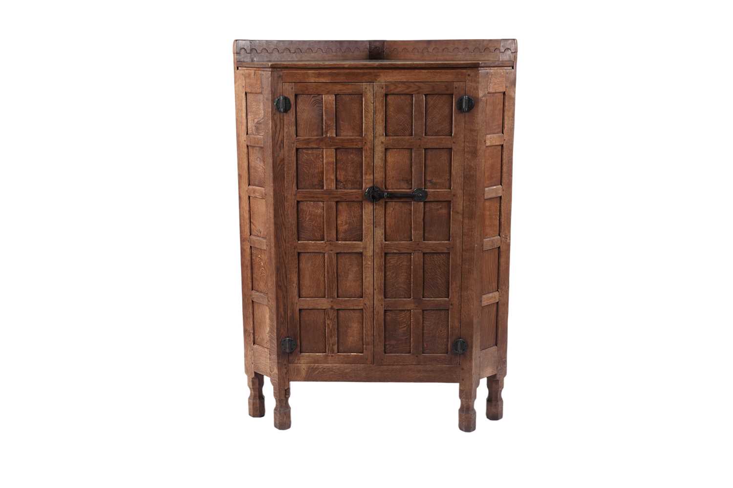 Lot 1429 - Robert ‘Mouseman’ Thompson of Kilburn: an oak floor standing corner cabinet