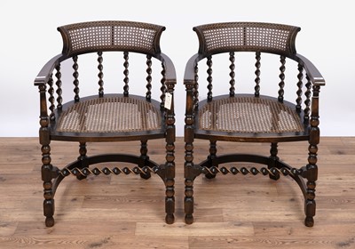 Lot 151 - A pair of early 20th Century stained beech and canework armchairs