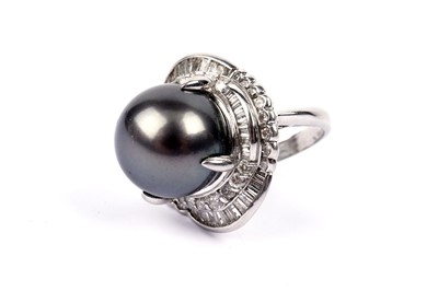 Lot 760 - A South Sea Island black pearl and diamond dress ring