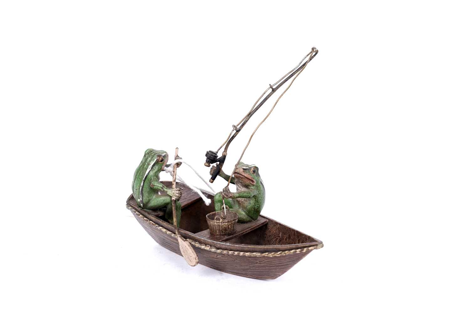 Lot 733 - A cold painted bronze group of two frogs in a fishing boat