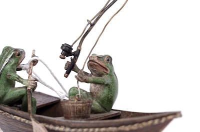 Lot 733 - A cold painted bronze group of two frogs in a fishing boat