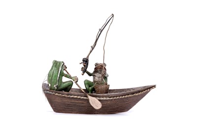 Lot 733 - A cold painted bronze group of two frogs in a fishing boat