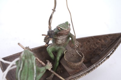 Lot 733 - A cold painted bronze group of two frogs in a fishing boat