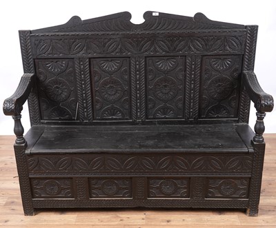 Lot 96 - A Georgian oak box settle