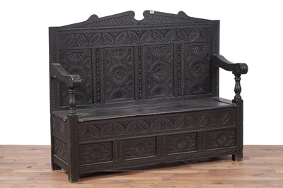 Lot 96 - A Georgian oak box settle