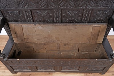 Lot 96 - A Georgian oak box settle