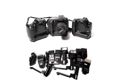 Lot 260 - Three Canon digital SLR cameras; and sundry photographic flash guns