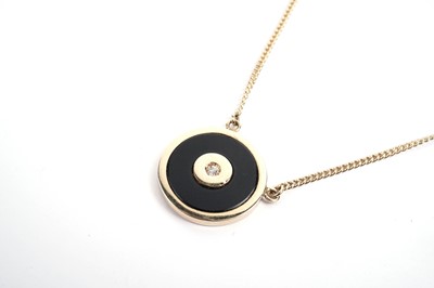 Lot 773 - Cartier, Paris: an onyx and diamond pendant