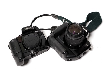 Lot 861 - Two Canon SLR cameras; and a Sigma lens