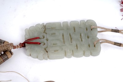 Lot 877 - A Chinese carved jade dagger and sheath; and a carved jade medallion