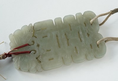 Lot 877 - A Chinese carved jade dagger and sheath; and a carved jade medallion