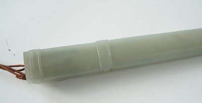 Lot 877 - A Chinese carved jade dagger and sheath; and a carved jade medallion