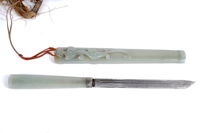 Lot 877 - A Chinese carved jade dagger and sheath; and a carved jade medallion