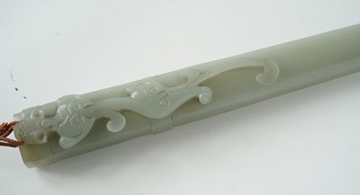 Lot 877 - A Chinese carved jade dagger and sheath; and a carved jade medallion