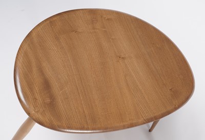 Lot 27 - An Ercol model 354 ‘Pebble’ nest of three elm topped tables