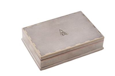 Lot 417 - A George VI silver and two-colour gold-decorated cigarette box