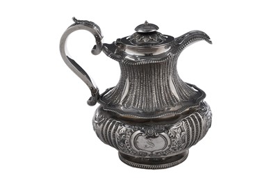 Lot 100 - A late George III silver hot water jug