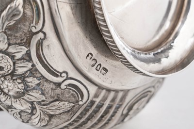 Lot 100 - A late George III silver hot water jug