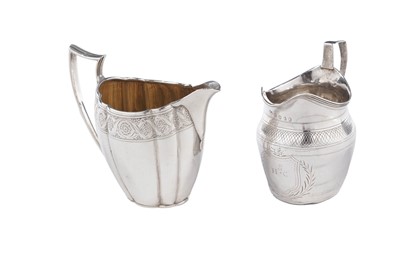 Lot 105 - Two silver cream jugs