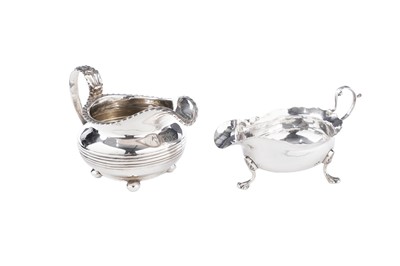 Lot 106 - A George III North Country silver sauceboat; and a silver cream jug