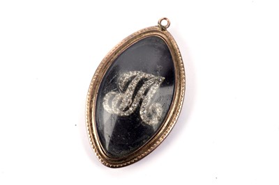 Lot 783 - A George III enamel and diamond mourning pendant