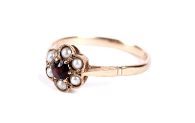 Lot 3 - A garnet and seed pearl flower cluster ring