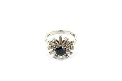 Lot 784 - A modern sapphire and diamond ring