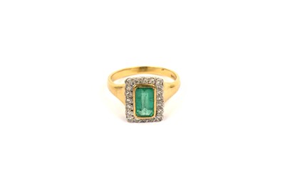 Lot 762 - A rectangular emerald and diamond cluster ring