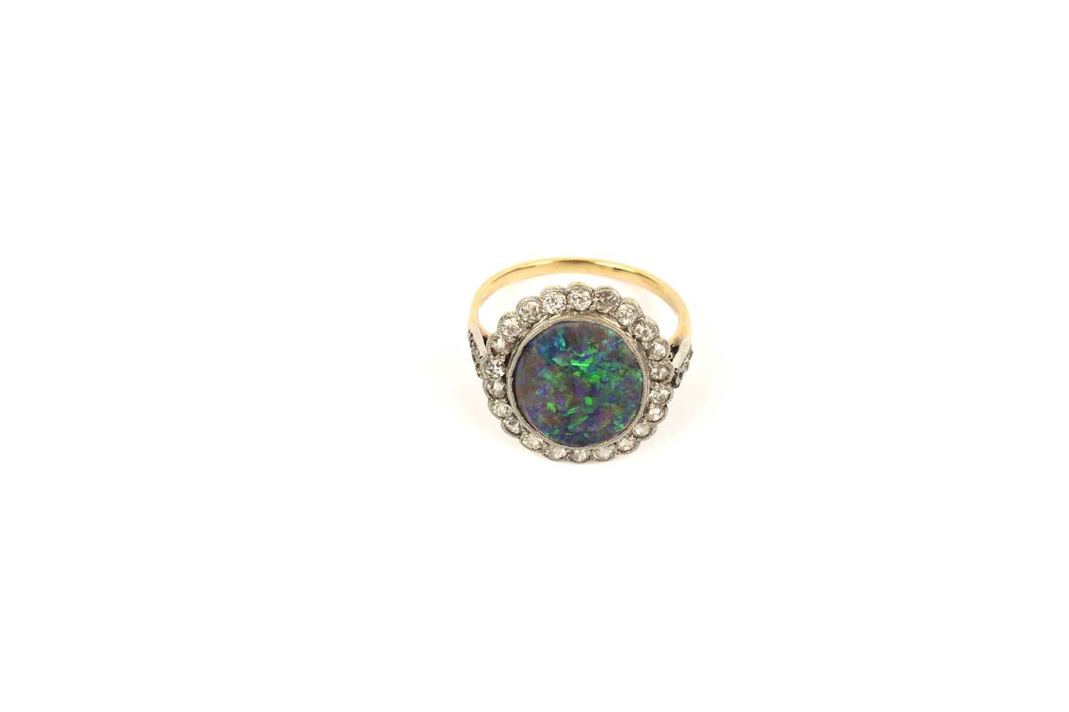 Lot 765 - A early 20th Century black-opal and diamond cluster ring