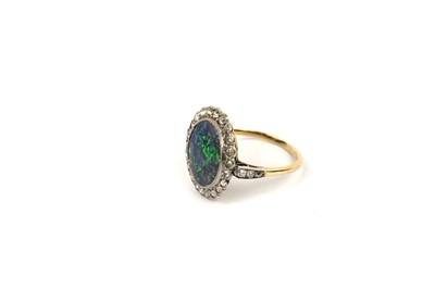 Lot 765 - A early 20th Century black-opal and diamond cluster ring