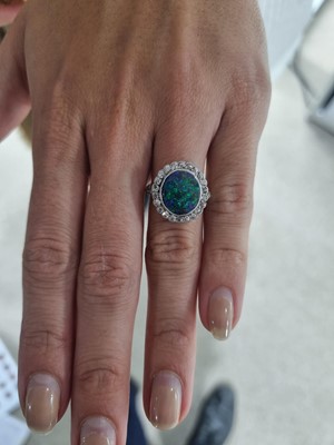 Lot 765 - A early 20th Century black-opal and diamond cluster ring