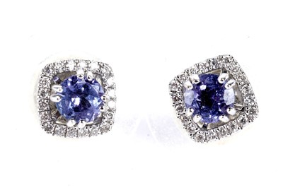 Lot 72 - A pair of tanzanite and diamond cluster earrings