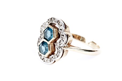 Lot 70 - A blue stone and diamond cluster ring