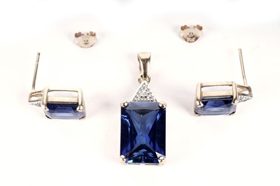 Lot 44 - A diamond and synthetic sapphire pair of earrings and matching pendant