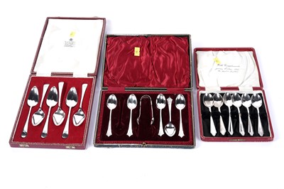 Lot 1107 - A collection of silver sugar tongs, grapefruit and teaspoons, some engraved with Fisher Family Crest