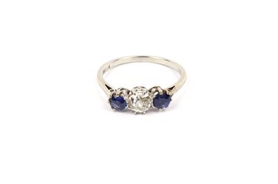 Lot 789 - A three stone sapphire and diamond ring