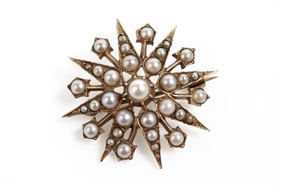 Lot 770 - An Edwardian seed pearl star brooch pendant