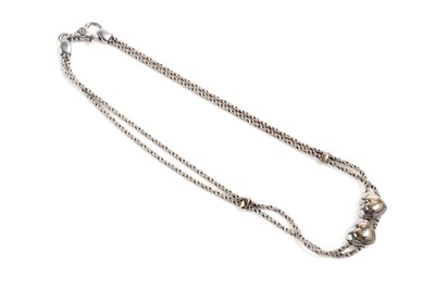 Lot 693 - Tiffany & Co: a silver and yellow gold twin heart necklace