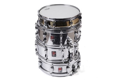 Lot 296 - A Pearl Piccolo snare drum; and three Premier chromium finish snare drums